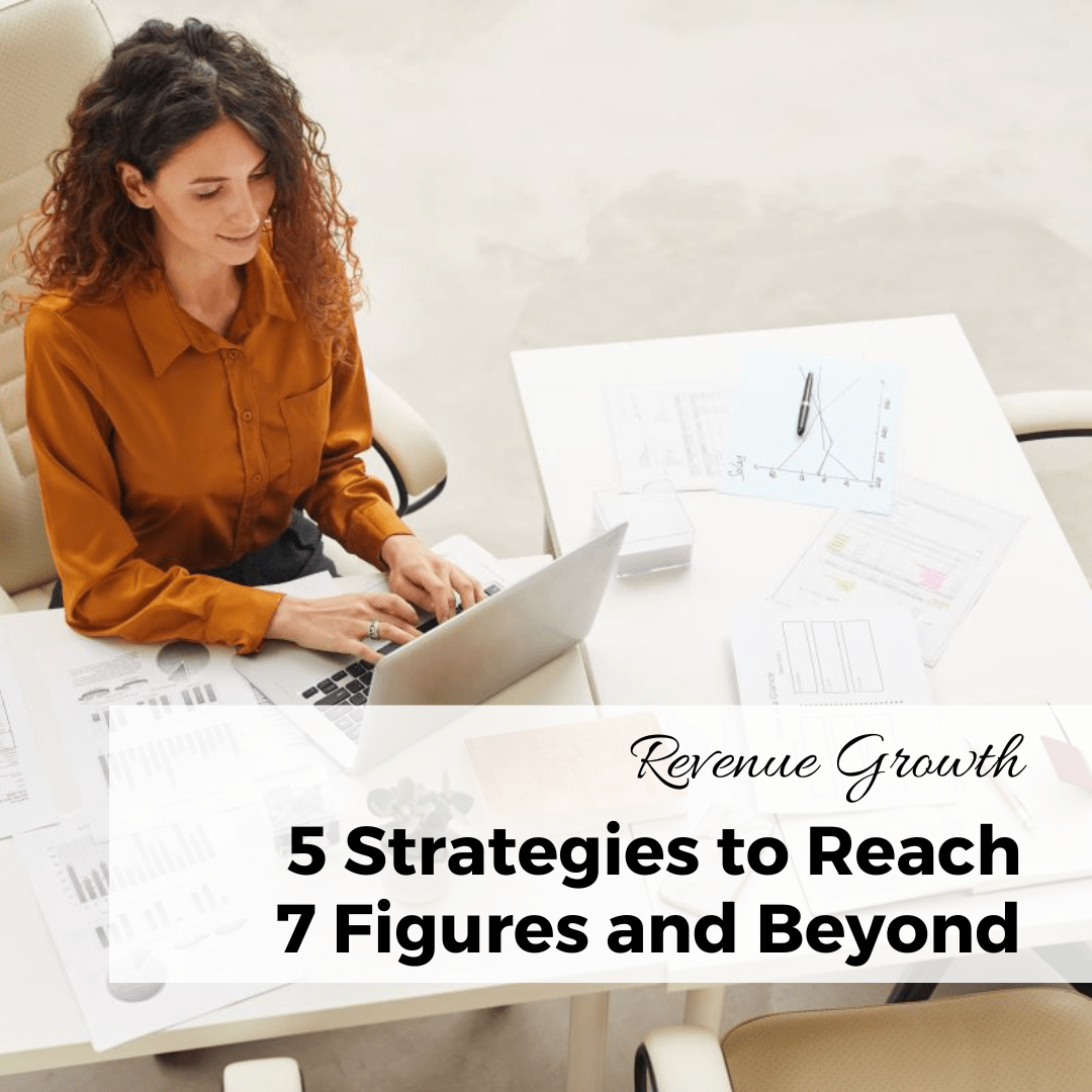 5 Strategies to Reach 7 Figures and Beyond female entrepreneur working on her computer